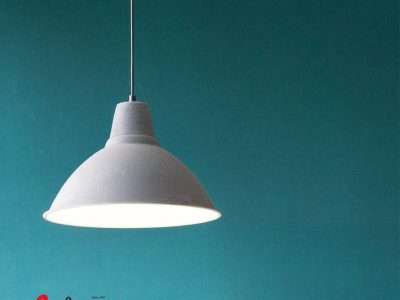 Hanging light fixture with Airco Service logo below