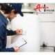 Technician working on water heater