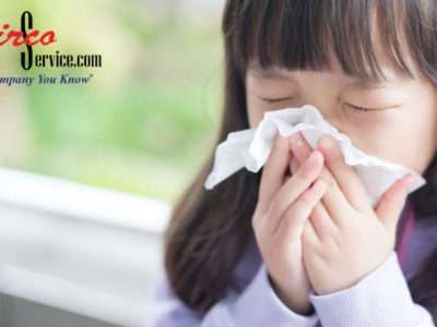 kid blowing nose