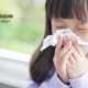 kid blowing nose