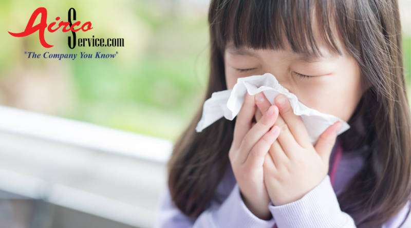 kid blowing nose