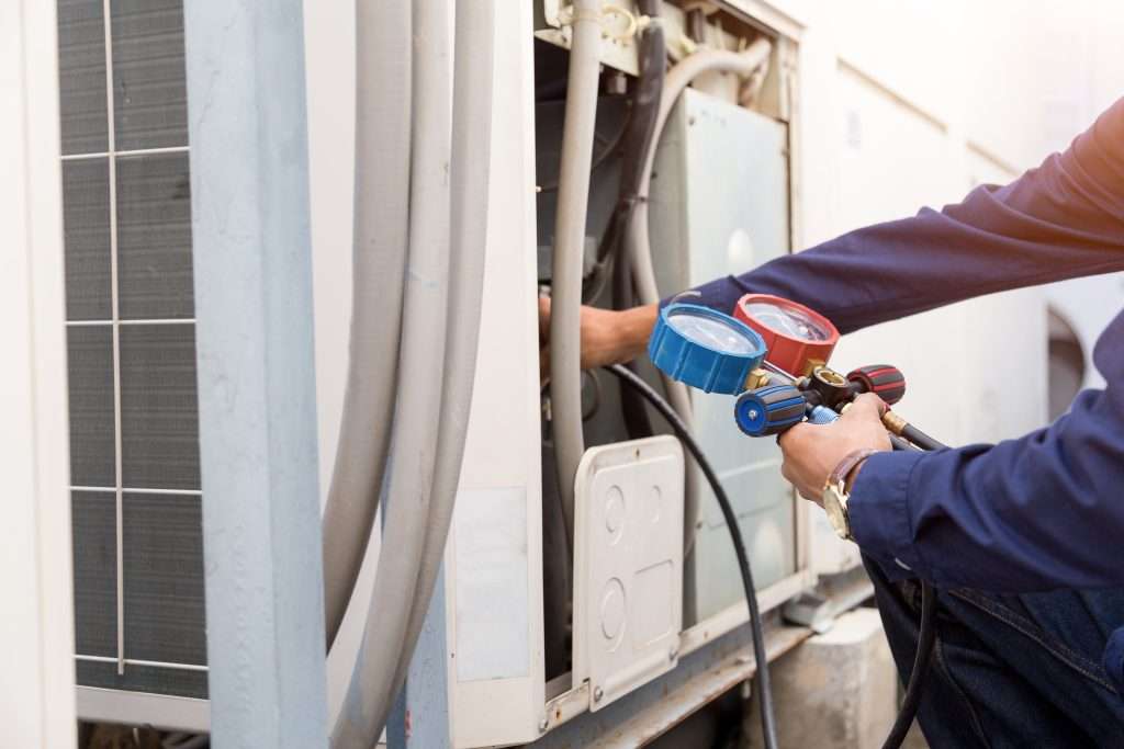 HVAC worker checking maintenance