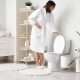 Person flushing toilet